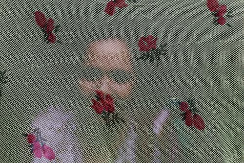 Salma behind fabric hiding her identity