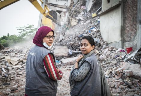 M M A Hasnat and Shamsun Naima Rahman of ActionAid at the site of the Rana Plaza collapse in 2013