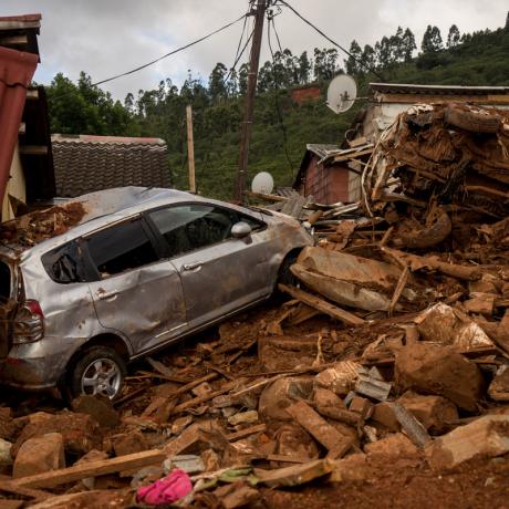 A home and a car destroyed by Cyclone Idai in Zimbabwe 