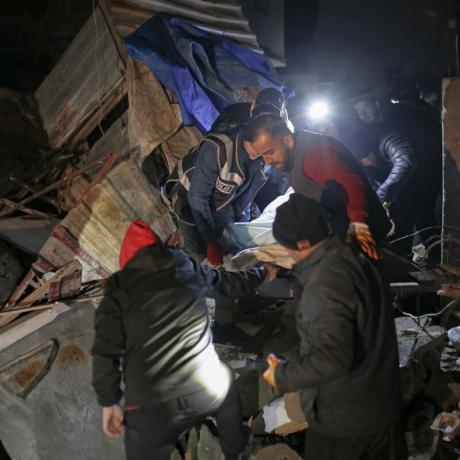Volunteers work through the night to rescue a woman who was trapped for over 30 hours in Hatay, Turkey