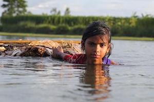 A girl wading through high water