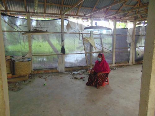 Dulali in her empty chicken shed, 2020