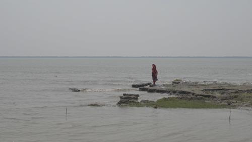 Liza Begum by the water in southern Bangladesh
