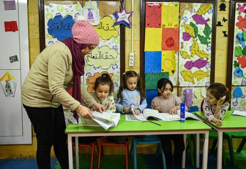 Mira, Sila, Besan, Sana and teacher Hasnaa in class at the Kareemat shelter.