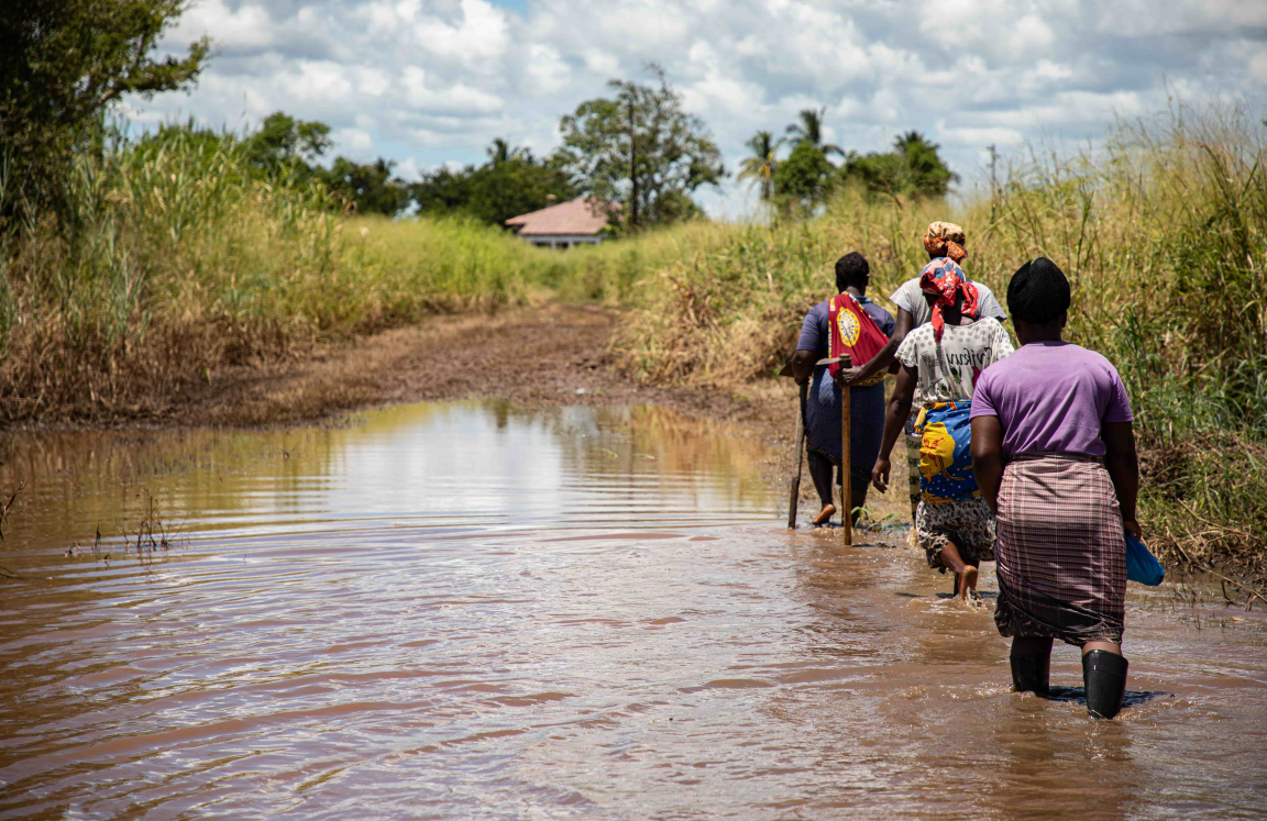 women walking through water