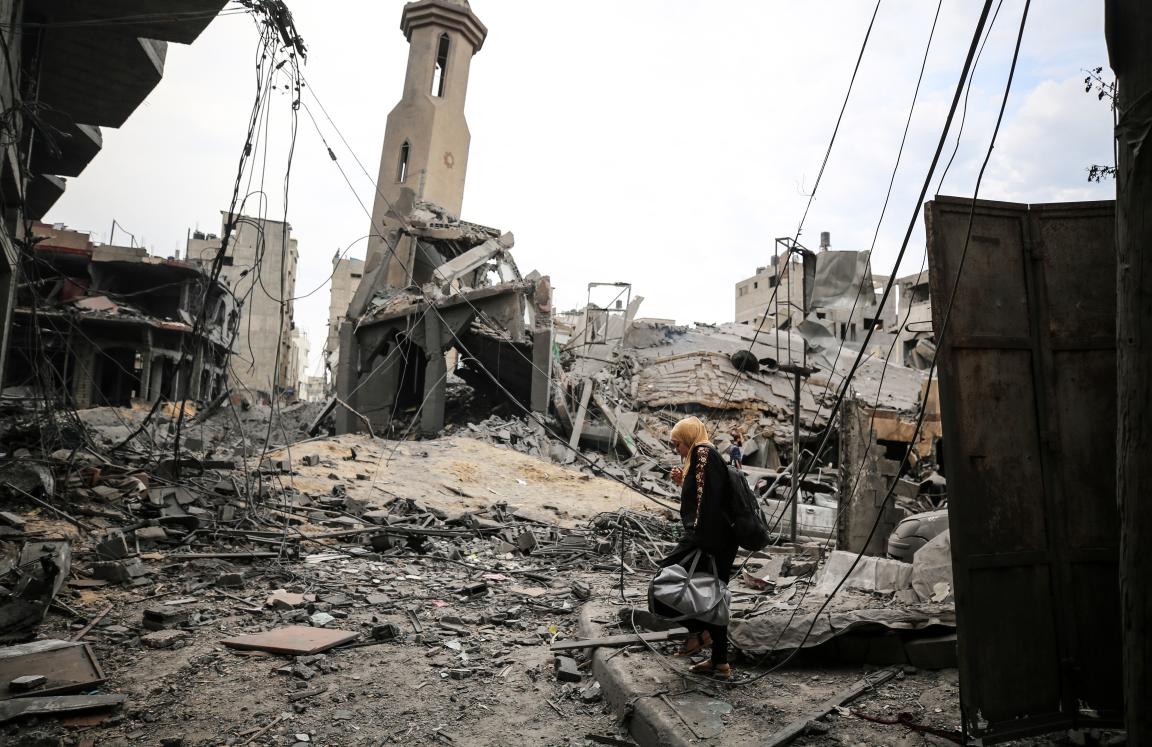Palestinians inspect a mosque destroyed in Israeli strikes on Gaza City's Shati refugee camp early on October 9, 2023.
