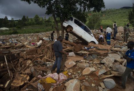 Community members sort through the rubble and damage left by Cyclone Idai in Ngangu township, Chimanimani, Zimbabwe.