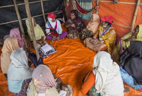 A women's commitee meeting discusses health issues at a Rohingya refugee camp