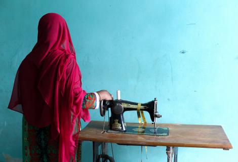 Rahima, with her sewing machine