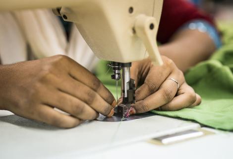 Woman sewing at a garment factory in Bangladesh