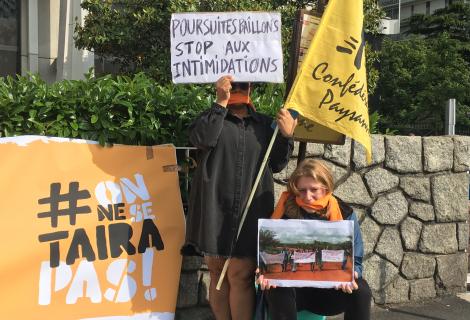 Protesters outside the General Assembly of Socfin, a Bolloré group company