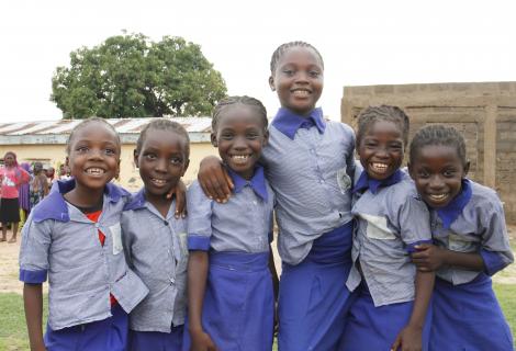 Photo shows happy schoolchildren in uniform