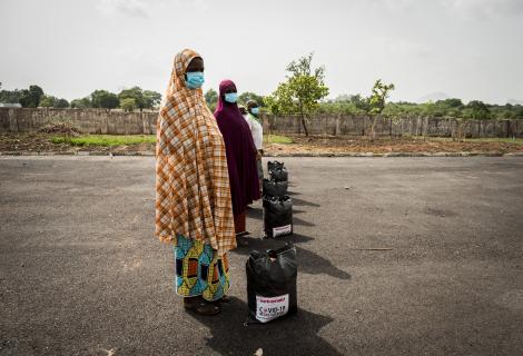 Women collecting Covid-19 relief packages