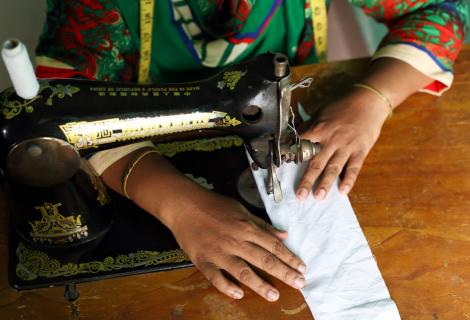 a woman using a sewing machine