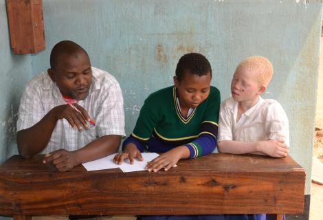 Hemedi and pupils in Tanzania