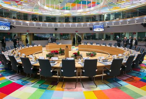 Inside the EU Council, roundtable with chairs and a multicoloured carpet 