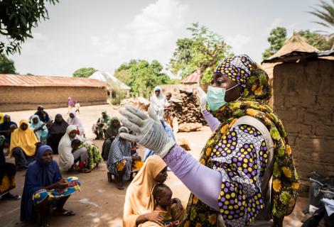 Suwaiba Yakubu Jubrin, Head of Programmes for ActionAid Nigeria informs members of Gwalada community about the novel Corona virus