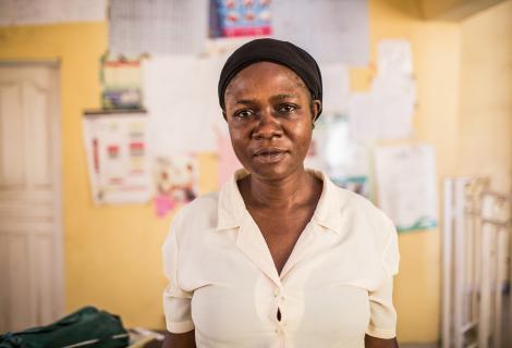 Orji is an unpaid nurse and midwife in a local hospital with no water source, no electricity and no government funding.