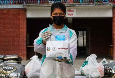 Monalisa, 16, volunteers during an ActionAid Nepal relief distribution, April 2020.