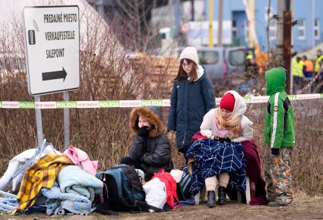 Refugees from Ukraine rest after arriving to the border crossing Vysne Nemecke, Slovakia.