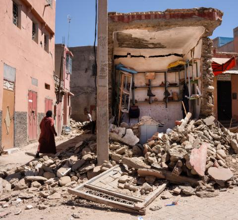 A woman walks next to a shop destroyed by the earthquake in the city of Amizmiz. The earthquake in Morocco on Friday 8 September was the worst in the country's history