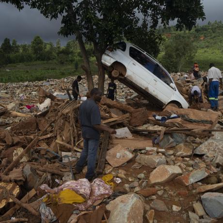 Community members sort through the rubble and damage left by Cyclone Idai in Ngangu township, Chimanimani, Zimbabwe.