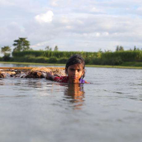 Girl swims through floods