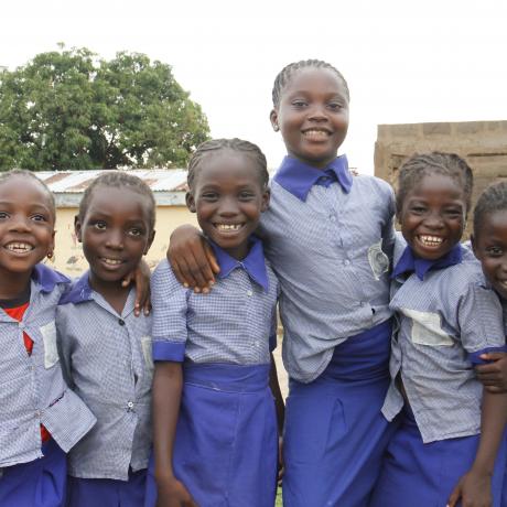 Photo shows happy schoolchildren in uniform