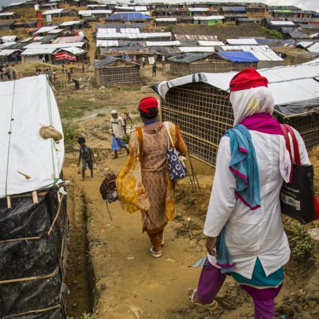 Women walk down a hill to the densely populated Mainnerghona refugee camp, Cox's Bazar