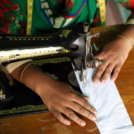 a woman using a sewing machine