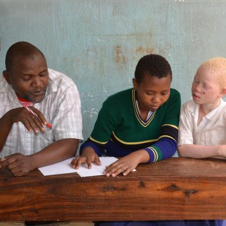 Hemedi and pupils in Tanzania