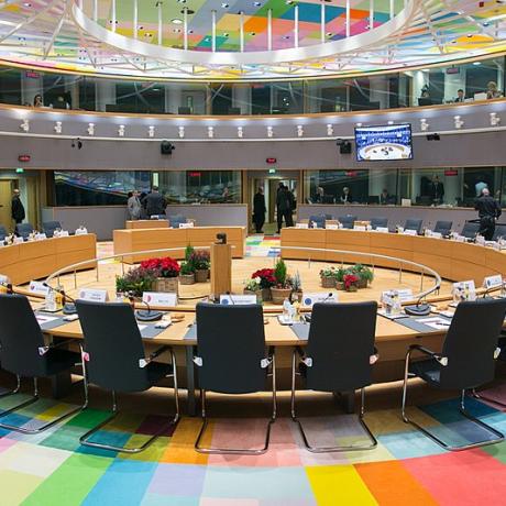 Inside the EU Council, roundtable with chairs and a multicoloured carpet 