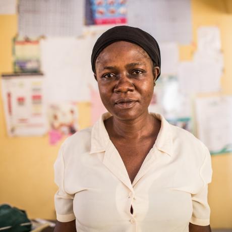 Orji is an unpaid nurse and midwife in a local hospital with no water source, no electricity and no government funding.