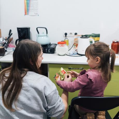 Veronika, a volunteer at Insight NGO an ActionAid partner, with her daughter Daniela at the Insight hub