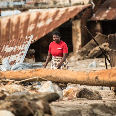 Director of Chigwirizano Women’s Movement and Action Aid partner Loveness Chiwaya is seen moving around Nkhulambe village, inspecting damage in the aftermath of Tropical Cyclone Freddy in Nkhulambe Village.