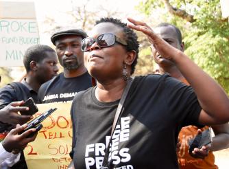 A protester in Zambia calling out corruption