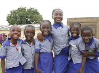 Photo shows happy schoolchildren in uniform
