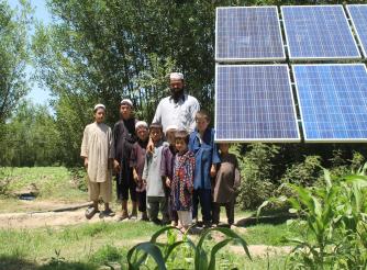 A family standing near a solar energy plant