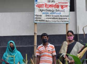 Facilitators and Farmers outside an ActionAid agroecology school in Bangladesh