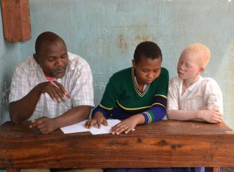 Hemedi and pupils in Tanzania
