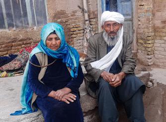 Abdul, 80, and Halima, 75, fled from Shindand District to Herat due to conflict and lack of food.