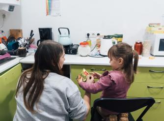 Veronika, a volunteer at Insight NGO an ActionAid partner, with her daughter Daniela at the Insight hub 