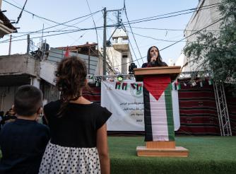 The Rise of Palestinian Women's Leadership in Refugee Camps, Shatha’s speaking at a Bazaar