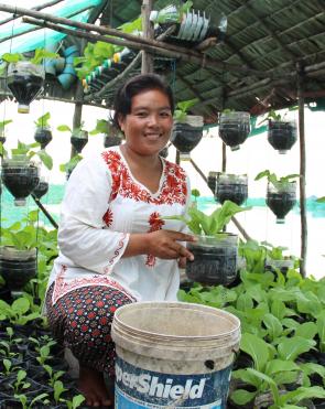 Sreymom is a community leader from Cambodia who has received sustainable farming training, reducing her expenses.