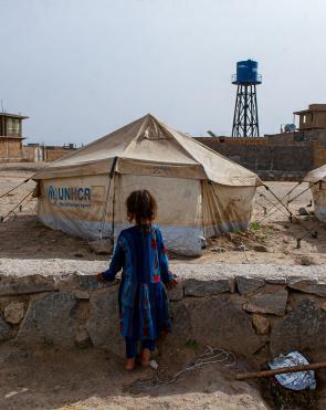 A girl stands in Shaiday refugee camp near Herat, which is home to 42,000 families.