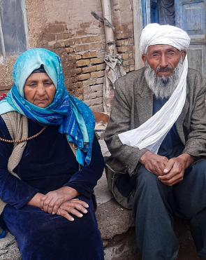 Abdul, 80, and Halima, 75, fled from Shindand District to Herat due to conflict and lack of food.