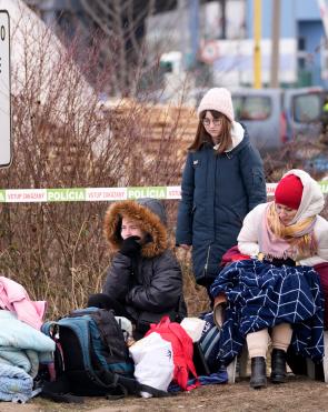 Refugees from Ukraine rest after arriving to the border crossing Vysne Nemecke, Slovakia.