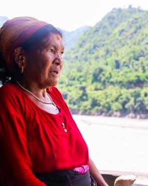 Nanimaya Senchuri looking at what is left after the devastating floods destroyed farmlands in her village