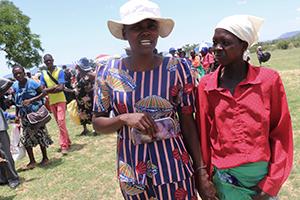 Emma (l) and Agnes (r) walk together are the food distribution point