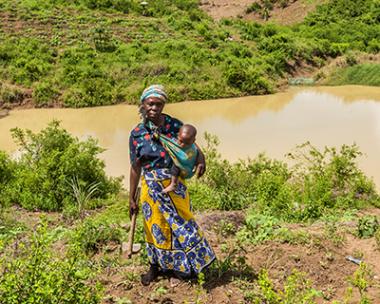 Janet Mnyazi, 42, at her farm in Gung'ombe village